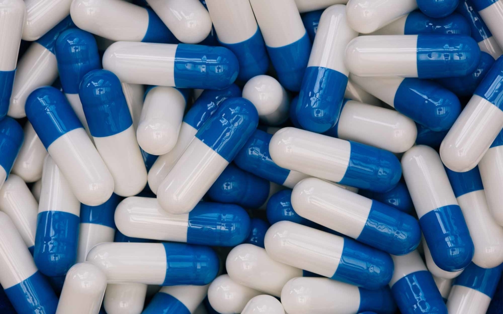 Large pile of blue and white supplements