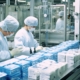 Workers packaging pharmaceutical products